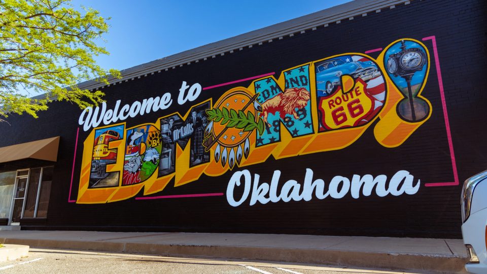 a mural on the side of a building that says welcome to ettin oklahoma at The  Campbell